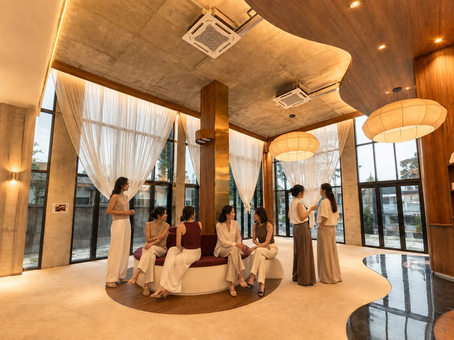 LUMA members connecting in the light-filled social lounge
